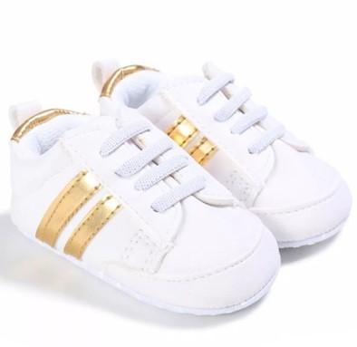 White Sneakers with Gold Stripes